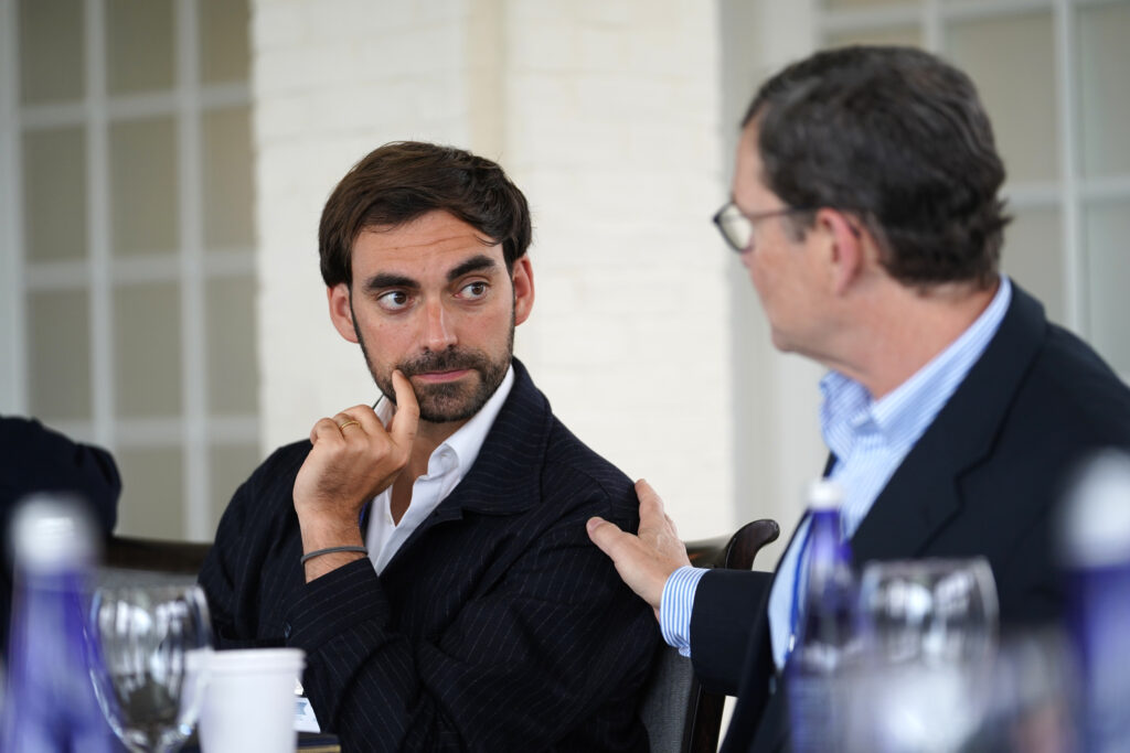 Image of Paul Fehlinger, Director of Policy, Innovation & Impact at Project Liberty Institute, listening to Mike Kubzansky, CEO of Omidyar Network